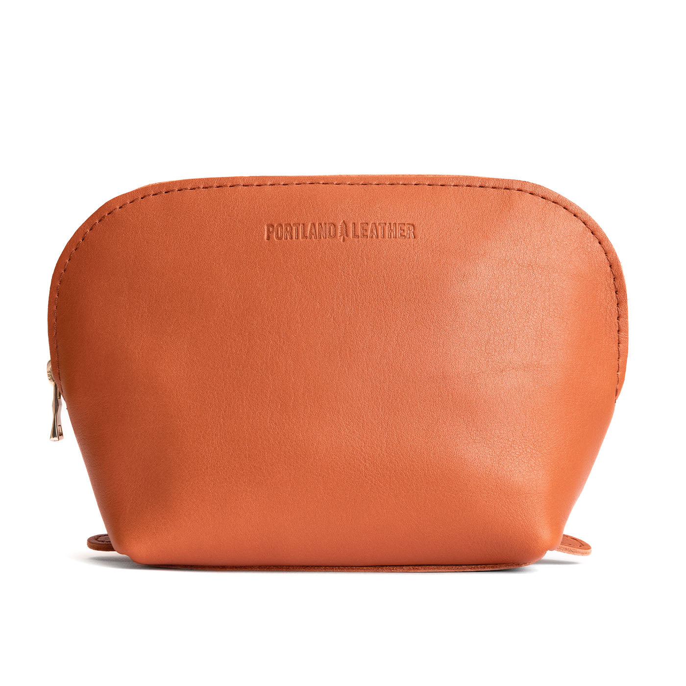 Persimmon*Belladonna | Leather makeup bag with curved top zipper and flat bottom