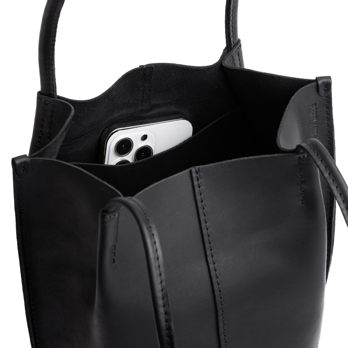 Black | Petite bucket shaped tote bag with matching leather handles