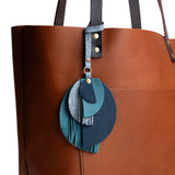 Neptune | Intricately cut leather shapes and fringe