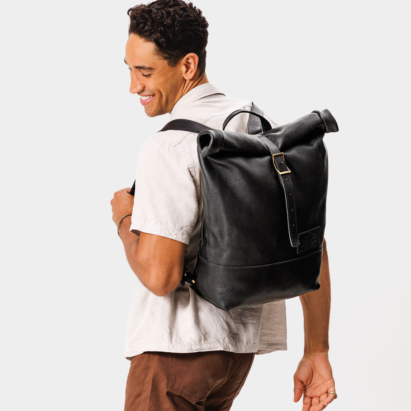 black leather roll top backpack