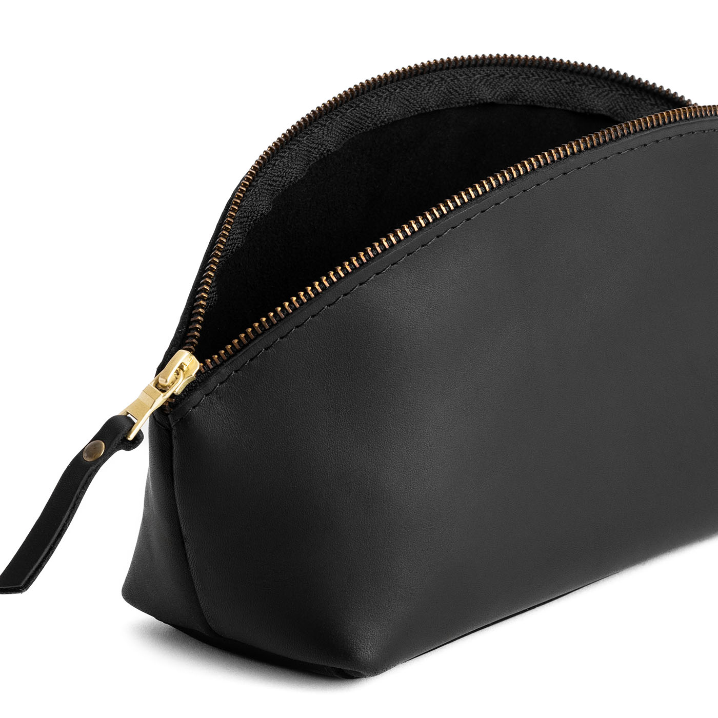 Black*Total Eclipse | Spacious leather makeup bag with curved seams and top zipper