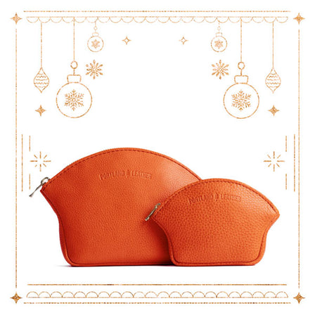 Koi*Small | Seashell shaped leather makeup bag with curved top zipper and flat bottom