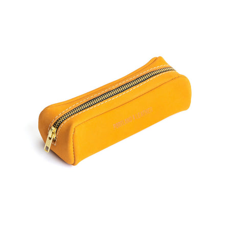 All Color: Turmeric | Leather pouch with a curved top and zipper