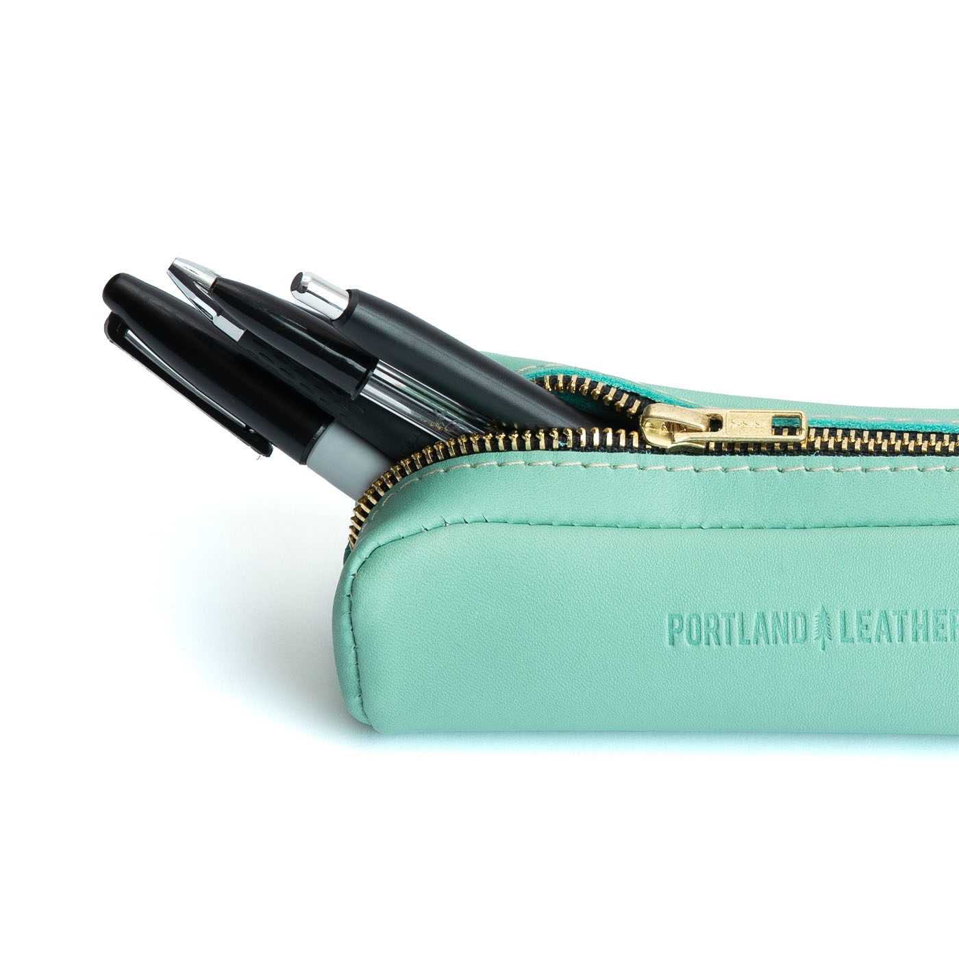 All Color: Mint | Leather pouch with a curved top and zipper