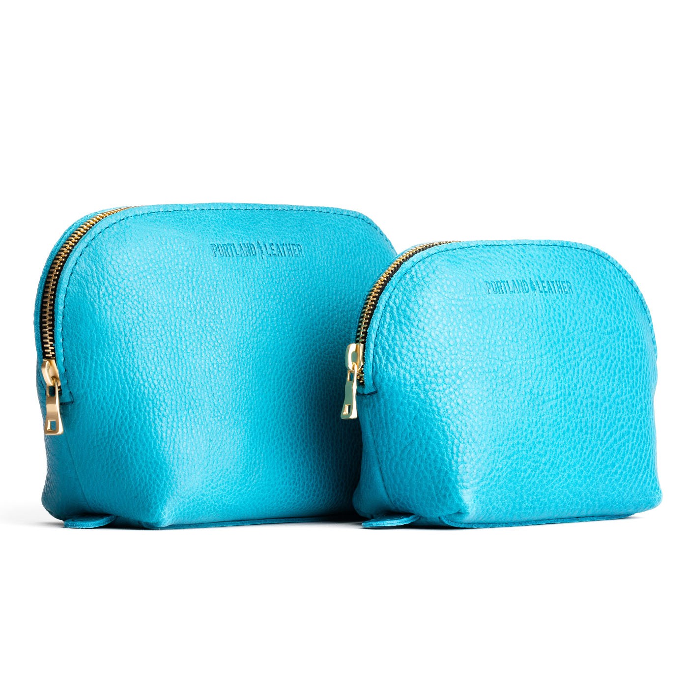 Baja | Leather makeup bag with curved top zipper and flat bottom