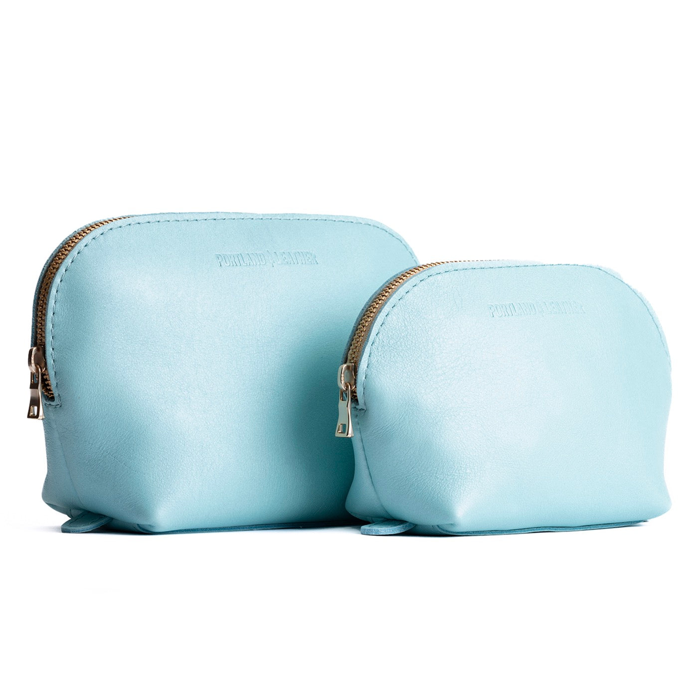 Cabo | Leather makeup bag with curved top zipper and flat bottom