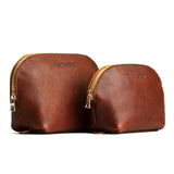 Nutmeg | Leather makeup bag with curved top zipper and flat bottom