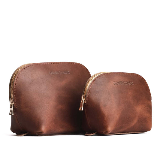 English Tan | Size comparison shot of leather makeup bags with curved top zipper and flat bottom