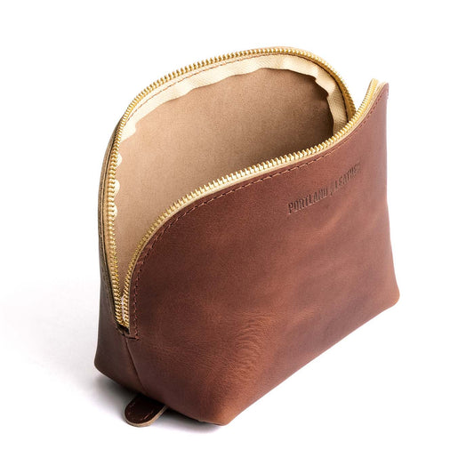 English Tan*Belladonna | Leather makeup bag with curved top zipper and flat bottom