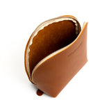 Honey Belladonna | Leather makeup bag with curved top zipper and flat bottom