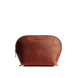 Nutmeg Belladonna | Leather makeup bag with curved top zipper and flat bottom