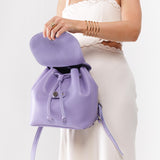 Wisteria | Model opening slouchy leather bucket backpack