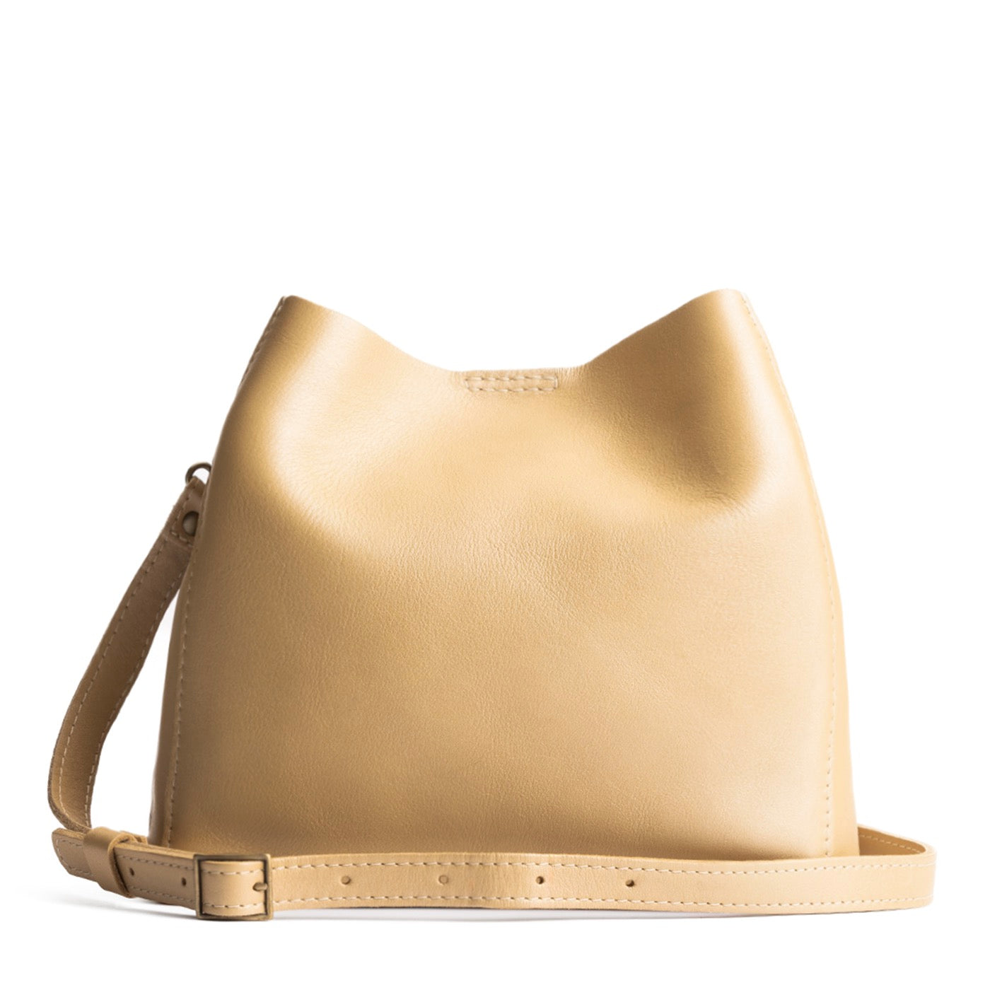 Champagne | symmetrical bucket bag with latch closure and removable crossbody strap