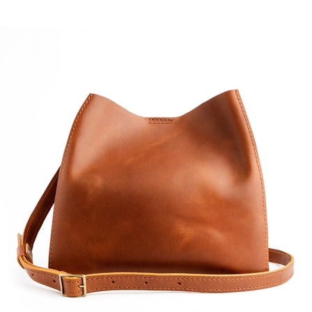 Honey | symmetrical bucket bag with latch closure and removable crossbody strap