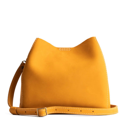 Turmeric | symmetrical bucket bag with latch closure and removable crossbody strap