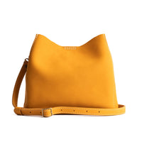  Turmeric | symmetrical bucket bag with latch closure and removable crossbody strap