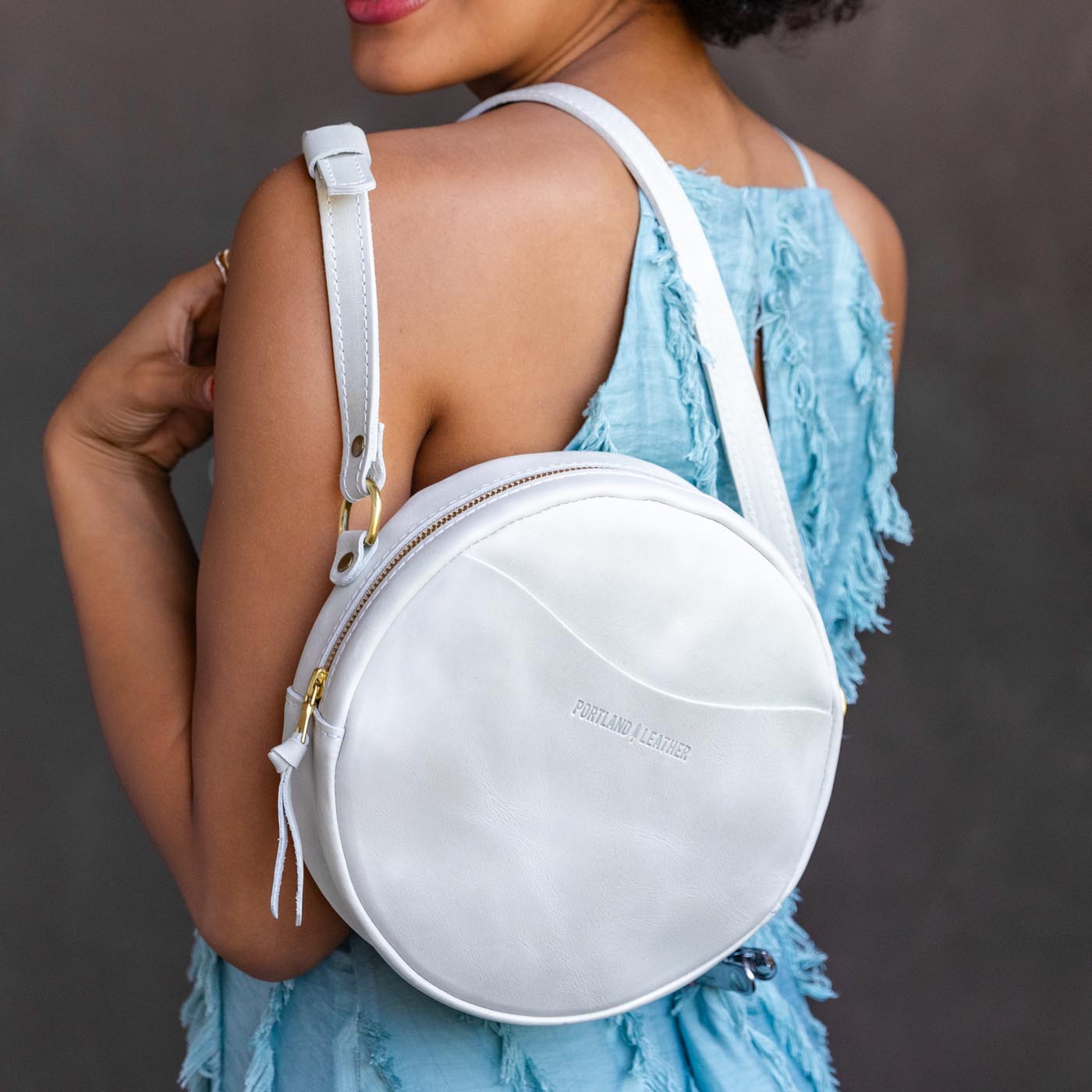 Beluga*Large | Circle shaped crossbody with exterior pocket and top zipper