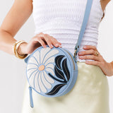 Wildflower Glacial Blue Small | Circle shaped crossbody bag with embroidered flower design