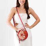 Wildflower Ruby Small | Circle shaped crossbody bag with embroidered flower design