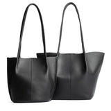 Black | Size comparison of classic and large bucket shaped tote bags with matching leather handles