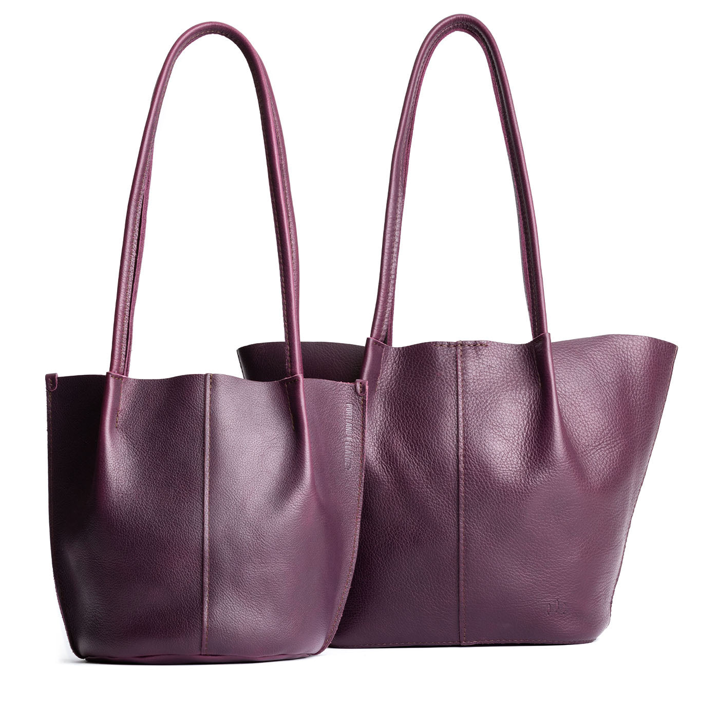 Plum | Size comparison of classic and large bucket shaped tote bags with matching leather handles