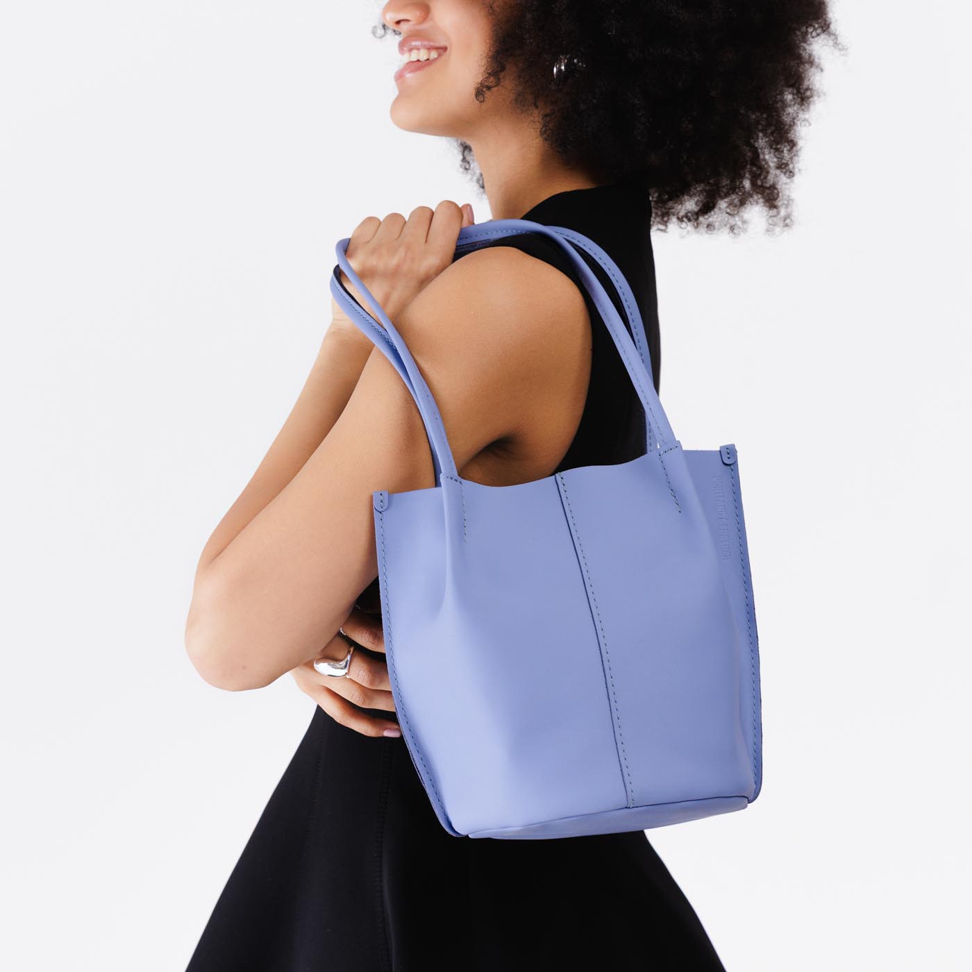 Jacaranda*Classic | Model wearing petite bucket shaped tote bag with matching leather handles