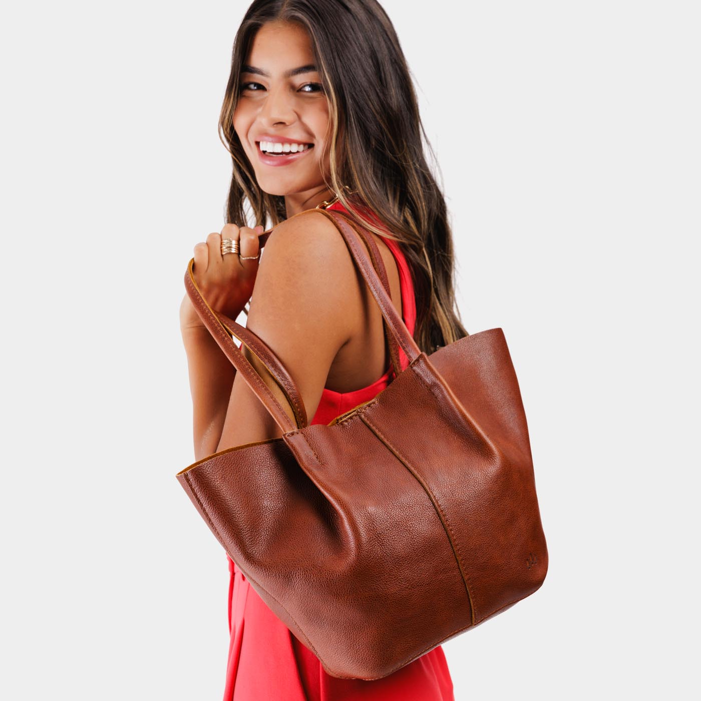 Nutmeg*Large | Model holding wide bucket shaped tote bag with matching leather handles