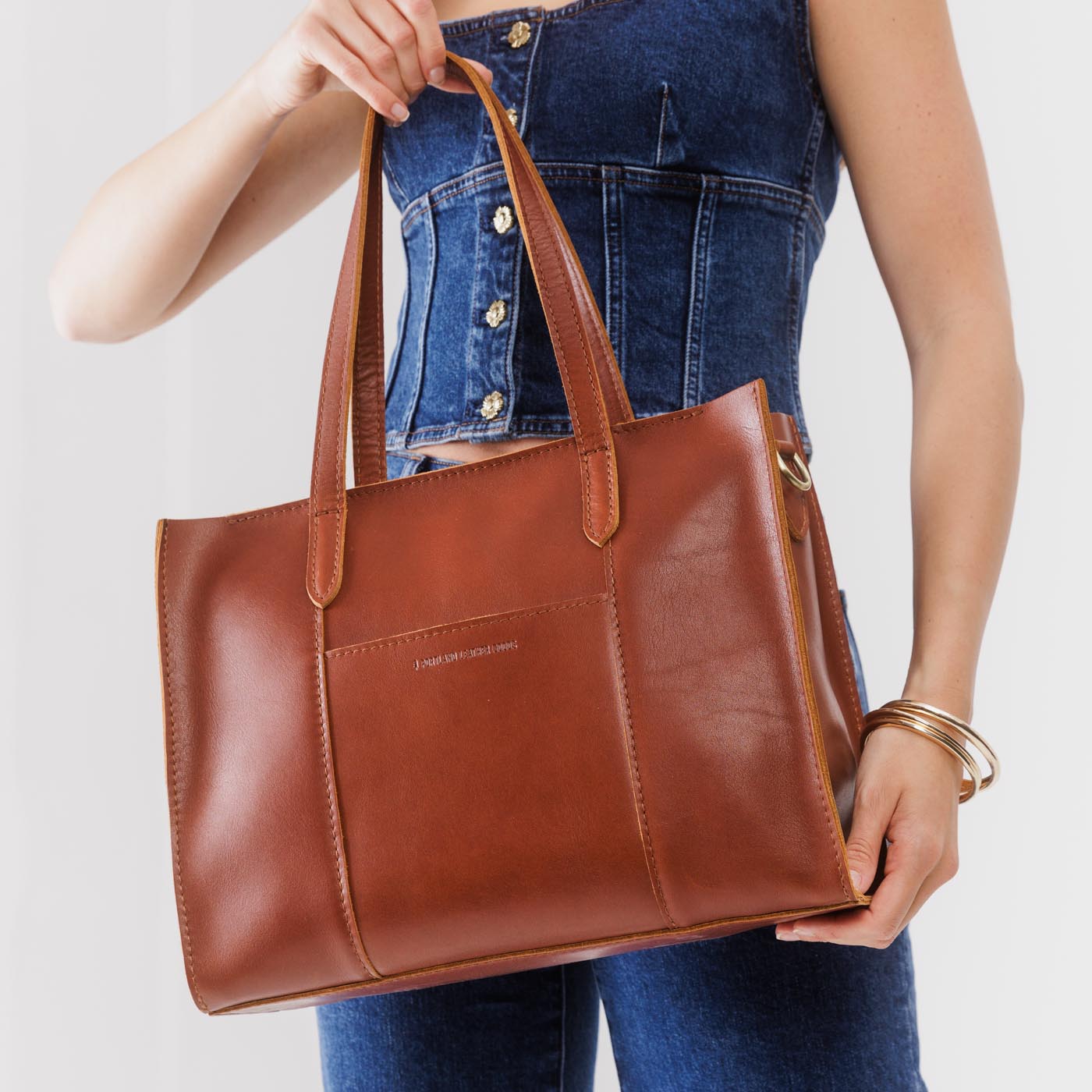 Chestnut*East/West | Structured wide tote bag with overlapping panels and crossbody strap