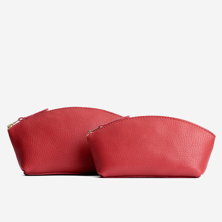 Sugar | Spacious leather makeup bag with curved seams and top zipper