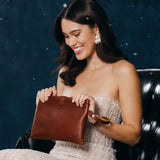 Chestnut | Model holding rectangular clutch with removable wristlet