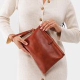 Chestnut | Model holding rectangular clutch with removable wristlet