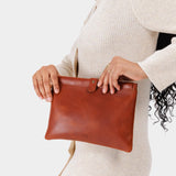 Chestnut | Model holding rectangular clutch with removable wristlet