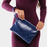 Cowboy Blue | Model holding rectangular clutch with removable wristlet