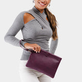 Plum | Model holding rectangular clutch with removable wristlet