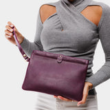 Plum | Model holding rectangular clutch with removable wristlet