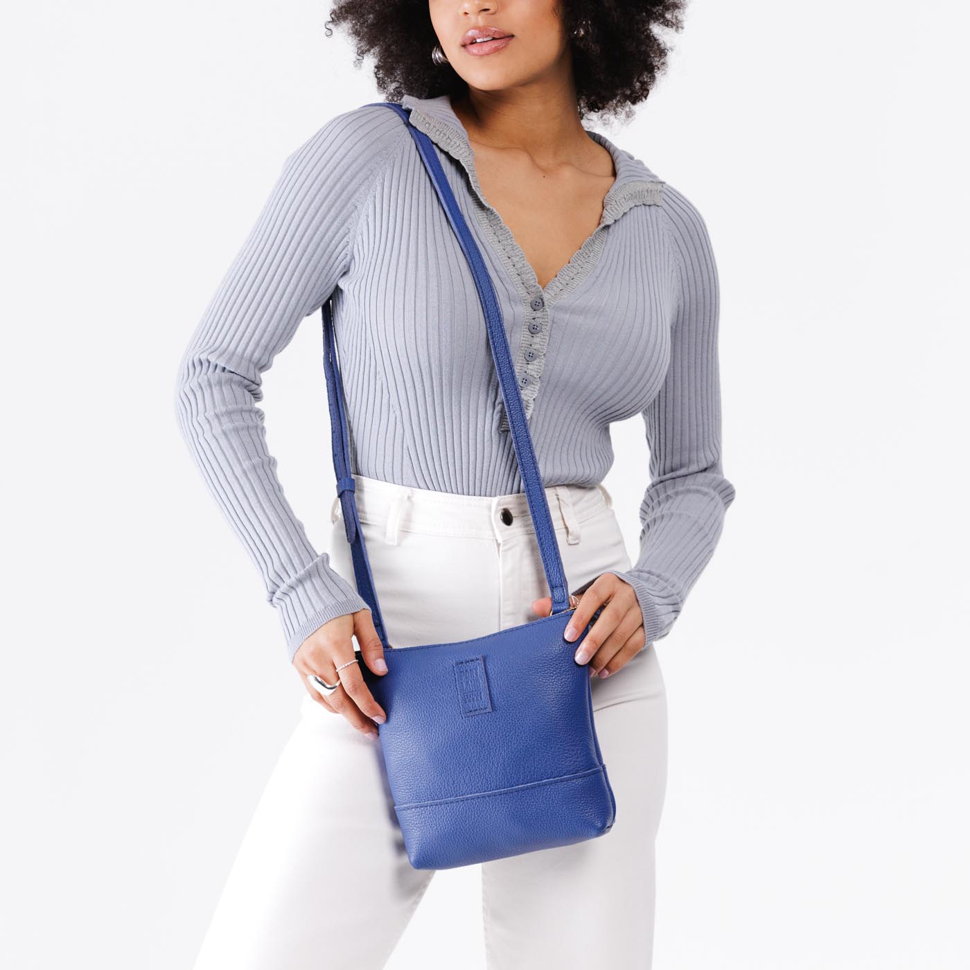 Molino Blue | Model wearing small rectangular crossbody purse with top zipper and interior pocket