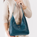 Lagoon | Model wearing structured hobo shoulder bag with adjustable strap and magnetic closure