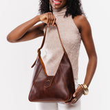 Timber | Model holding structured hobo shoulder bag with adjustable strap and magnetic closure