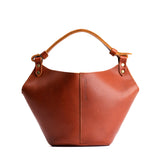 Chestnut Small | Structured bucket shaped handbag with an adjustable shoulder strap