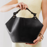 Black Large | Structured bucket shaped handbag with an adjustable shoulder strap