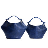 Cowboy Blue | Structured bucket shaped handbag with an adjustable shoulder strap