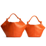 Koi | Structured bucket shaped handbag with an adjustable shoulder strap