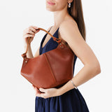 Chestnut Small | Structured bucket shaped handbag with an adjustable shoulder strap