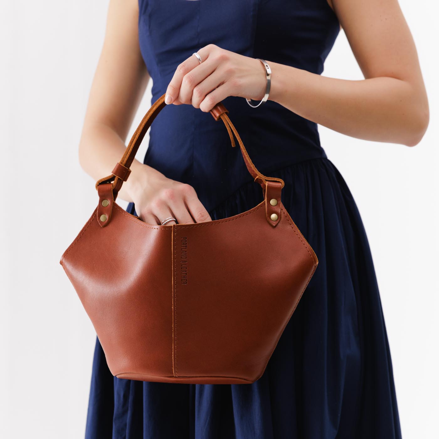 Chestnut*Small | Structured bucket shaped handbag with an adjustable shoulder strap