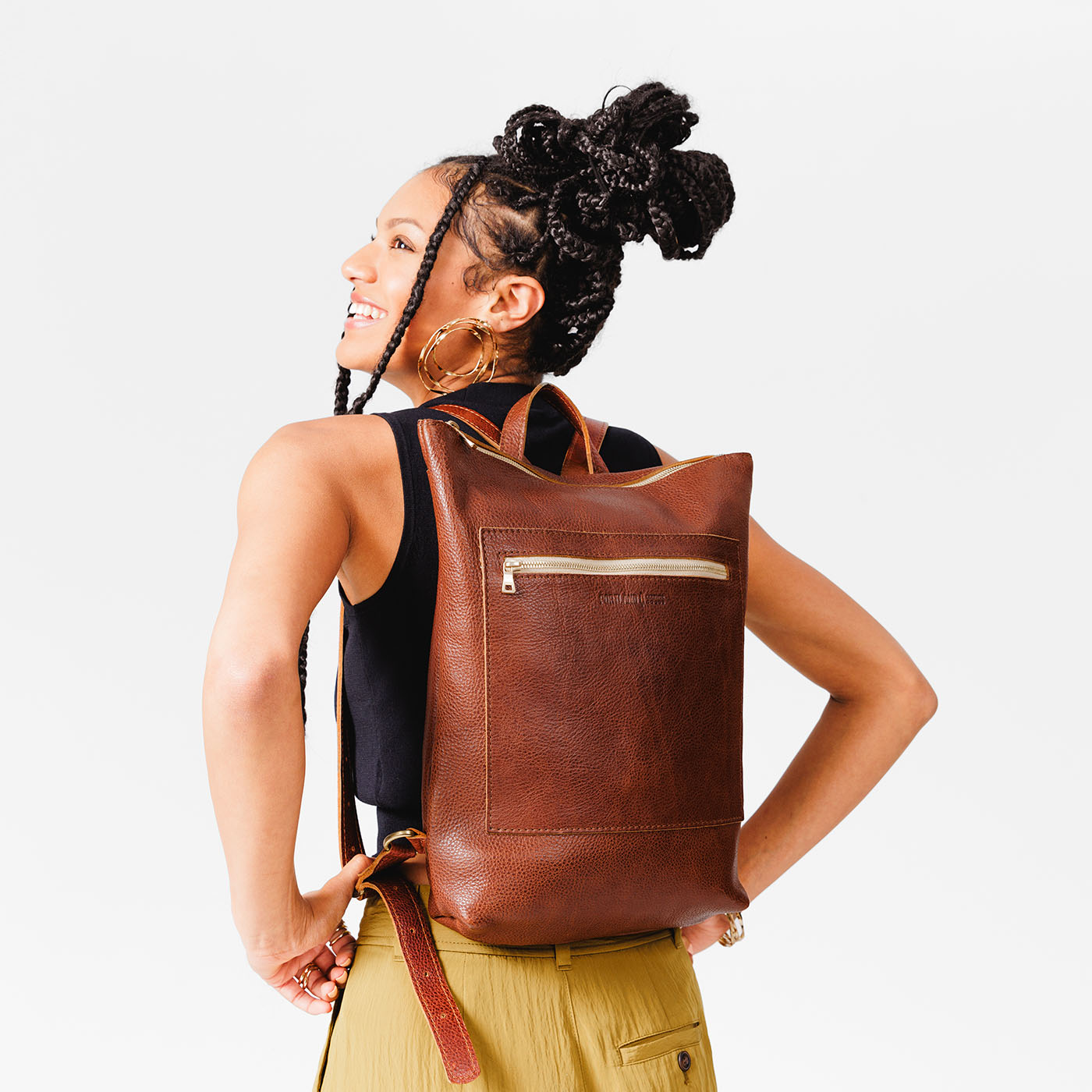 All Color: Nutmeg | Model wearing rectangular slim leather backpack