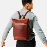 All Color: Nutmeg | Model wearing rectangular slim leather backpack