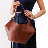 Nutmeg Large | Structured bucket shaped handbag with an adjustable shoulder strap