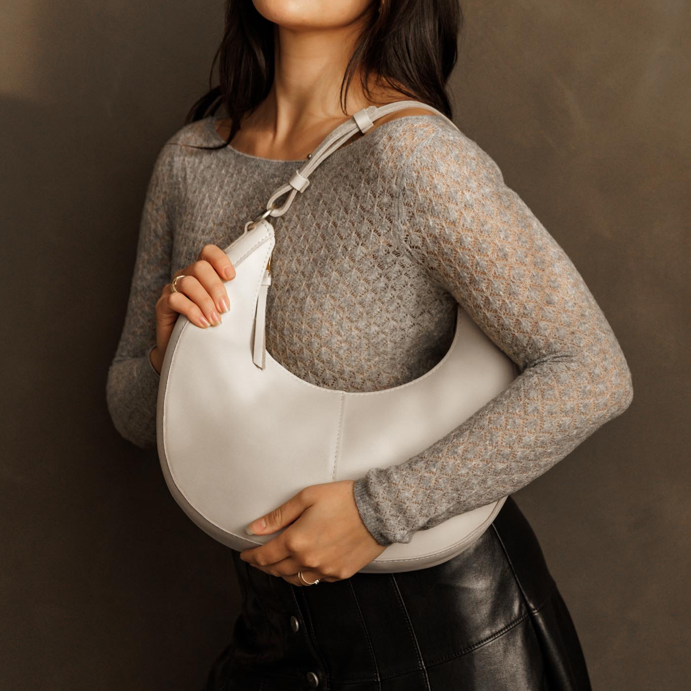 Bone*Large | Crescent shaped shoulder bag with zipper closure and adjustable strap