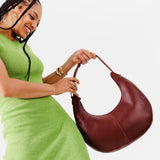 Cognac Large  | Large crescent shaped shoulder bag with zipper closure and adjustable strap