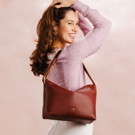 Nutmeg*Small | Petite slouchy leather shoulder bag with zipper opening and three metal tree emblems